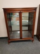 A mahogany double door display cabinet,