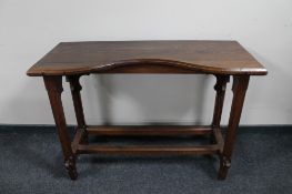 An antique pine church table with under stretcher