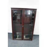 A mahogany double door bookcase