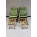 A pair of teak steamer armchairs with foot rests and cushions