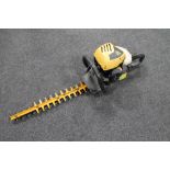 A JCB petrol hedge trimmer