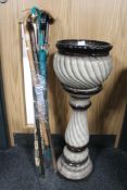 An antique pottery jardiniere on stand and a bundle of walking sticks