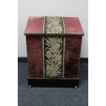 An antique fabric covered storage box
