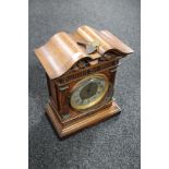 A 19th century continental mahogany mantel clock with silvered dial