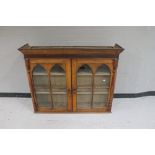 An antique oak double door bookcase top