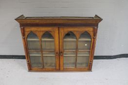 An antique oak double door bookcase top