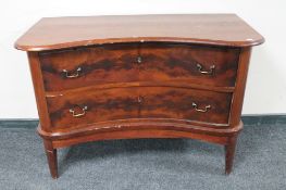 An antique continental mahogany shaped front two drawer chest
