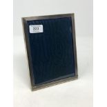 A silver easel photo frame, 15.5cm by 20.