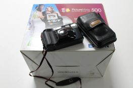 A boxed Field Epsom 500 Picture Mate printer and a Canon camera