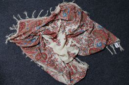 A 19th Century Paisley shawl, fringed, 150 cm x 150 cm.