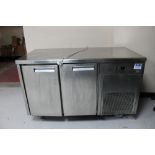 A stainless steel double door refrigerated counter