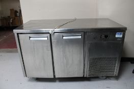 A stainless steel double door refrigerated counter