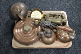 A tray of antique brass and copper ware, kettles, flasks, brass horn and miniature oil lamp,