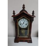 An antique mahogany and pine American style mantel clock