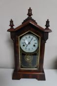 An antique mahogany and pine American style mantel clock