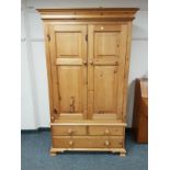 A good quality pine double door wardrobe,