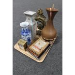 A tray of ornate gilt metal mantel clock, copper jug, five framed miniature advertising items,