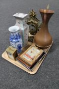 A tray of ornate gilt metal mantel clock, copper jug, five framed miniature advertising items,