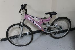 A girl's Trax TFS full suspension mountain bike