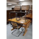 Four Italian kitchen chairs on tubular metal legs and a pine refectory dining table