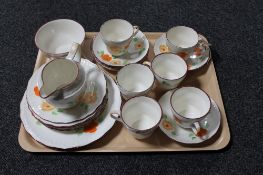 A tray of twenty-two piece hand painted china tea service