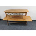Two mid century teak coffee tables with undershelves