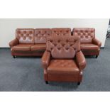 A mid 20th century Danish brown leather three piece lounge suite