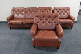 A mid 20th century Danish brown leather three piece lounge suite