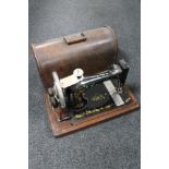 A cased vintage Singer sewing machine
