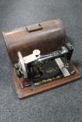 A cased vintage Singer sewing machine