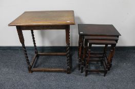 An Edwardian oak occasional table together with a nest of three oak tables