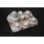 A tray of twenty-seven pieces of Royal Crown Derby bone china floral tea service