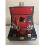 A jewellery box containing wristwatches, costume jewellery, chains, Festival Brass band badge,