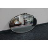 An oval framed Art Deco chrome mirror