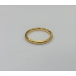 A 22ct gold band ring, size K, 2.9g.