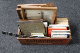 A vintage Schweppes crate containing antique and later photographs and prints depicting ships and