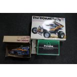 A boxed Tamiya The Hornet remote controlled racking car together with a boxed Futabea control unit