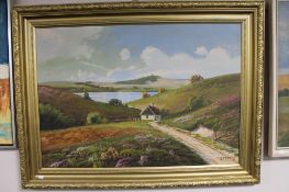 A 20th century gilt framed oil on canvas of a rural homestead, signed S.