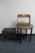 An Edwardian oak two tier wall shelf together with a folding eastern brass topped table and a mid