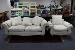 A two seater settee and armchair in cream classical print plus loose cushions