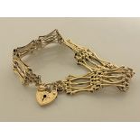 A 9ct gold bracelet with heart clasp, 13.8g.