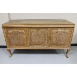 An early 20th century blonde oak triple door sideboard CONDITION REPORT: width 169