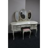 A cream and gilt dressing table with dressing mirror and stool