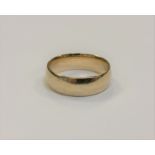 A 9ct gold band ring, size V, 7.3g.