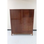 A mid 20th century linen cabinet fitted six drawers