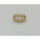 A 9ct gold band ring, size L, 3.2g.
