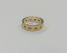 A 9ct gold band ring, size L, 3.2g.