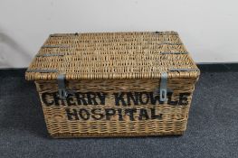 A wicker laundry hamper marked Cherry Knowle Hospital
