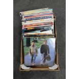 A box of seventy-five vinyl records - Madonna, The Bangles, Elton John,