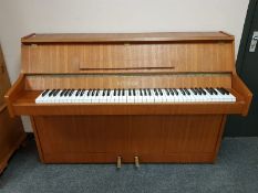 A teak cased upright overstrung piano by Bentley,